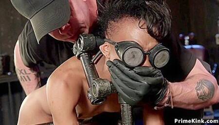 Slim Ebony Sub In Doggy Metal Device With Nikki Darling