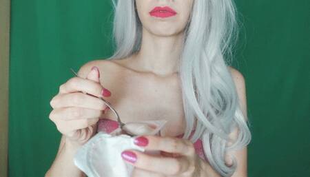 chewing and eating white creamy yoghurt