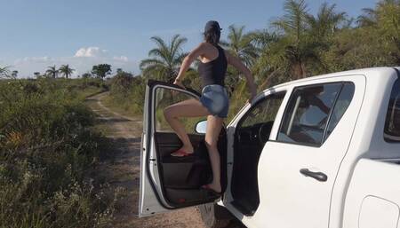 Bruna has a good time playing with a Hilux!