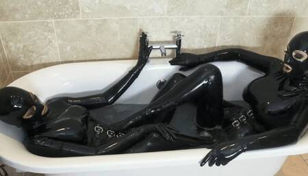 Two Hot Babes Full Encased In Black Latex Catsuit In Rubber Bathing - Part 1 of 3 - The Pussy Meeting