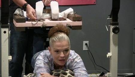 Mature vette put in the inverted stocks! "omg, i cant move my feet! like this!"