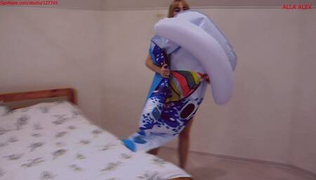 Alla inflates a rare inflatable catamaran with her mouth