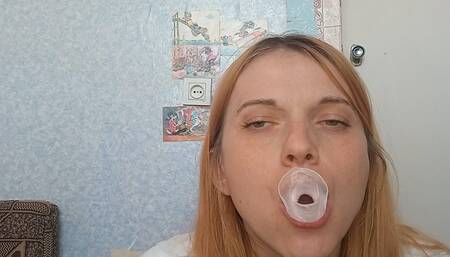 Trying to inflate a giant gum bubble