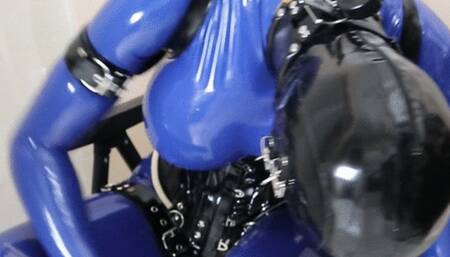 Blue Rubberdoll Bound to Chair, Triple Masks into Inflatable Hood and Vibrates Rubber Pussy