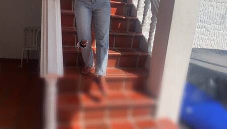 Dalilah in her favorite car pumping the pedal barefoot