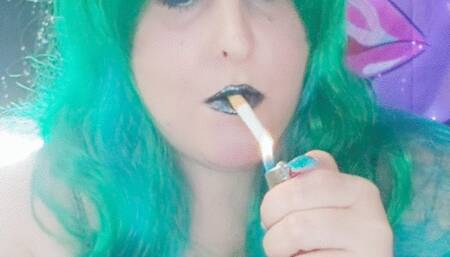 Nicki plays and smokes in black latex dress and boots