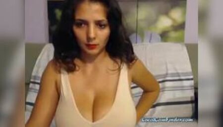 Brunette posing her huge big tits