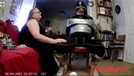 Man being duct taped to chair