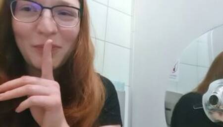 Cute Redhead Teen masturbates on public toilet