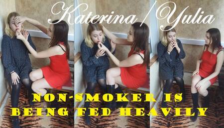 Non-smoker is being fed heavily