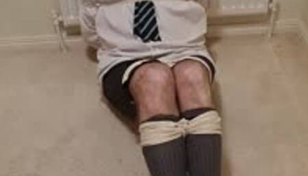 Tied up in adult school uniform and made to hop