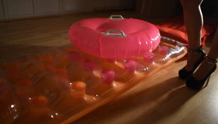 Walking and trample over inflatable pool mattress with sexy heels and crush