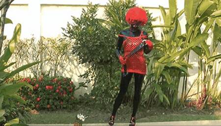 Black rubber latex doll with red sexy outfit and wig in the swimming pool