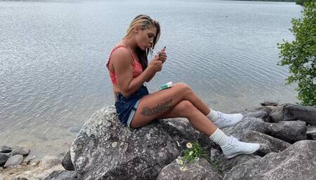 Newport 100 Smoke on the rocks by a lake