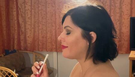 Full dangle an entire cigarette - heavy smoking in profile