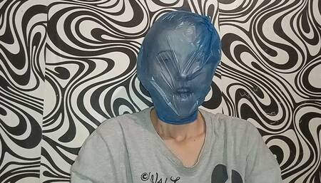 Smothering your face with a clear bag