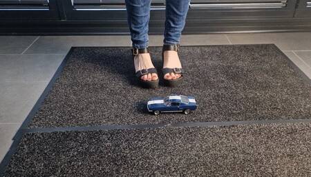 Abby Giantess crush a toy car 1966 Shelby Mustang in Black platform high heels high side view