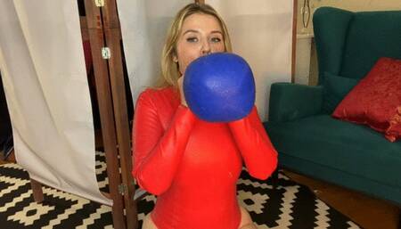 stuffing balloon in red latex suit