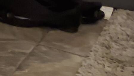 Shoe dangling in my flats after work in opaque tights