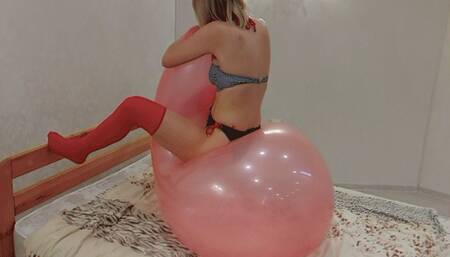 Alla rides and inflates a large 36-inch balloon with a long neck with her mouth!!!