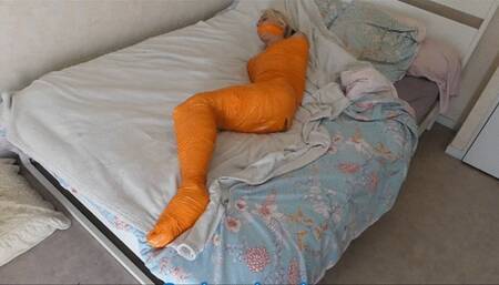 Kaylia mummified in orange tape