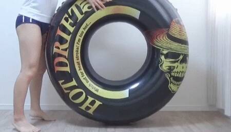 Wearing gym clothes and bloomers, ride vertically on the float