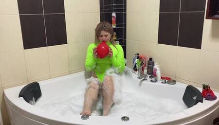 3 Blow2Pops in a one-piece swimsuit in a jacuzzi