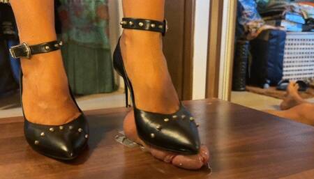 Shoejob with black studded height heels