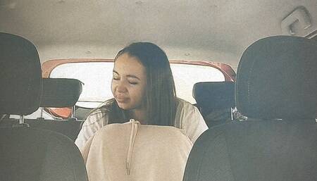 Went to the bathroom in a public place inside her car!