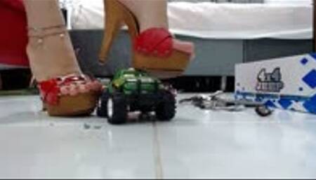 crushing the 4x4 Truck with a trailer for Bike in her red wooden sandals and Birkenstocks