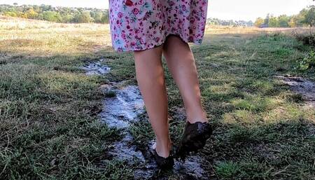 Walks through the mud and washes his feet in the stream