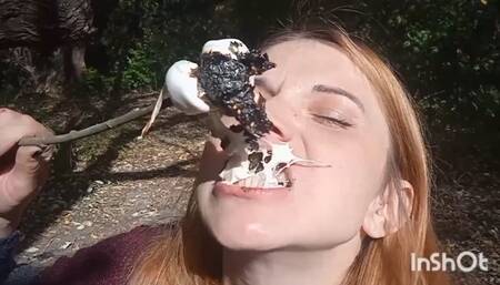 Eating food cooked over a fire in the forest