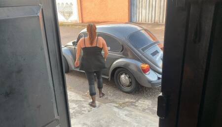 Barbara takes the VW Beetle out for a Sunday drive in flip flips and dark pantyhose