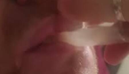 Man bound in neoprene sleepsack made to swallow his own cum