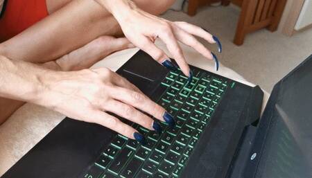Long talons typing keyboard