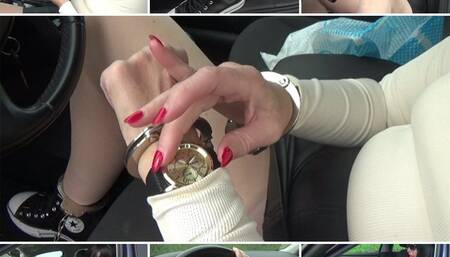 A moment to yourself in the car with a wristwatch and handcuffs