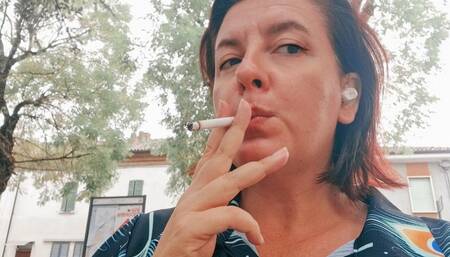 Smoking in a public park sexy Italian stepmother