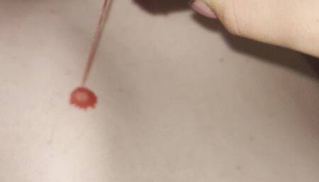 Girl performs wax play on a tied up male slave