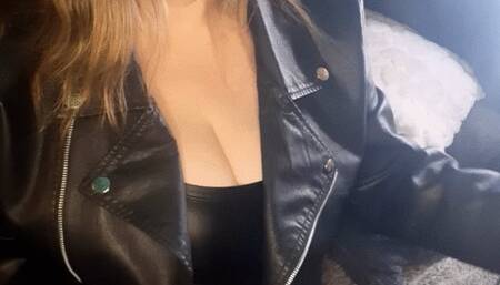 Smoking in a leather dress and jacket