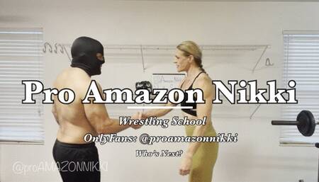 OMG! Powerful Amazon teaches the grapevine and scissors to new wrestling student! Poor fool!