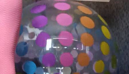 jumping on giant doteed ball