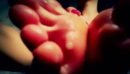 Red toes sucking close up