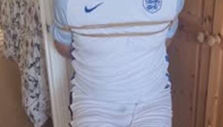 Bound and gagged footballer struggling in room