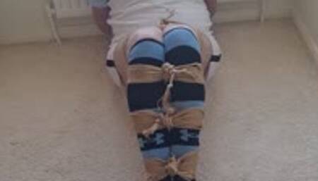 Bound and gagged in football kit