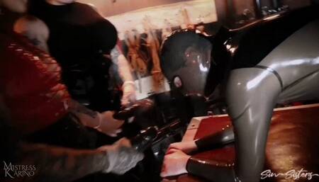 2 Dommes pegging with big strapons on rubber slave