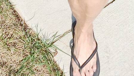 Tempest in flip flops showing off bare toes