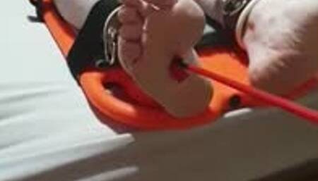 Feet tickling torment