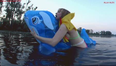 Alla rides on an inflatable squeaky inflatable whale and gets real pleasure, but falls into the water and is saved with the help of an inflatable airline vest!!!
