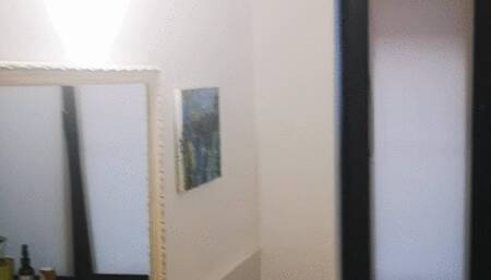 Dangling a cork cigarette at work, applying makeup while the boobs are escaping