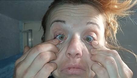 A woman plucks out her eyes (eye test)